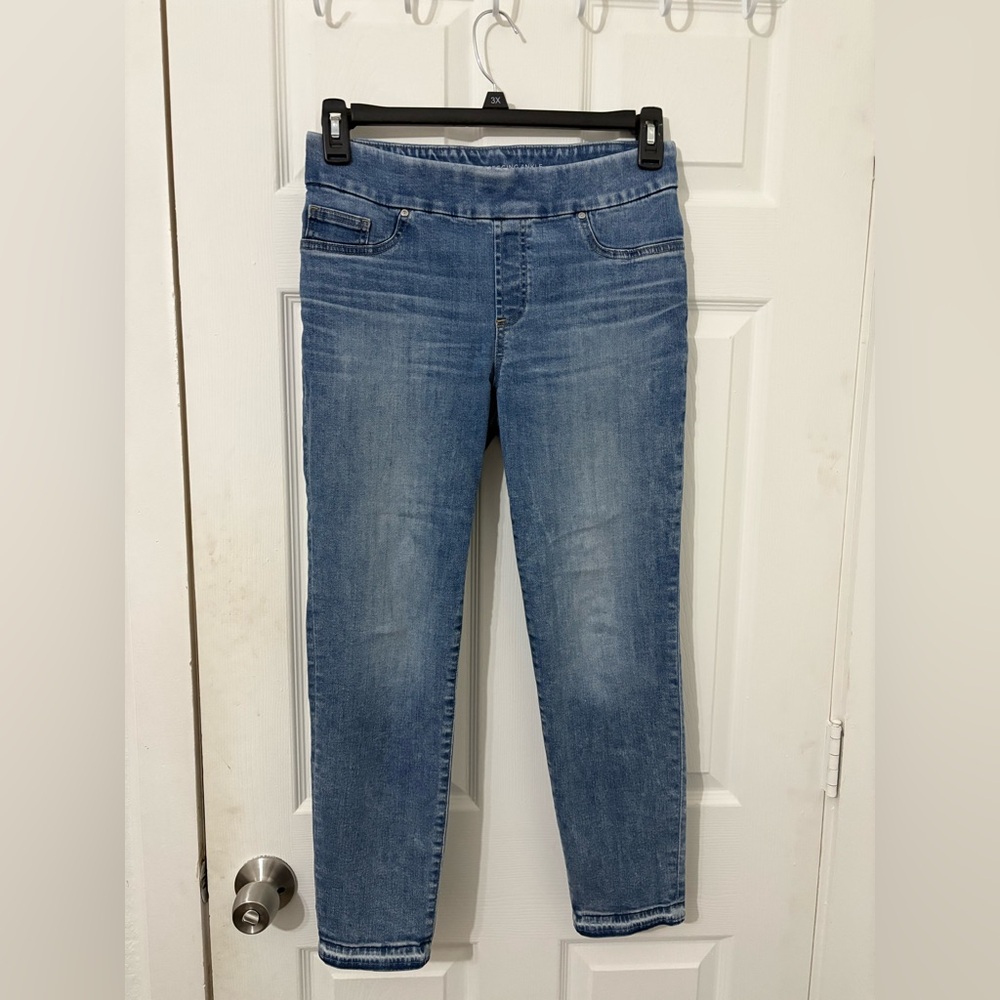 Chico’s pull on skinny jeans with bleached hem detailing